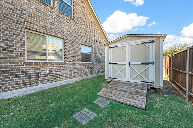 view of outdoor structure featuring a lawn