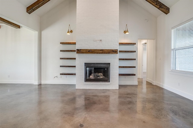 unfurnished living room featuring a brick fireplace, beam ceiling, and high vaulted ceiling