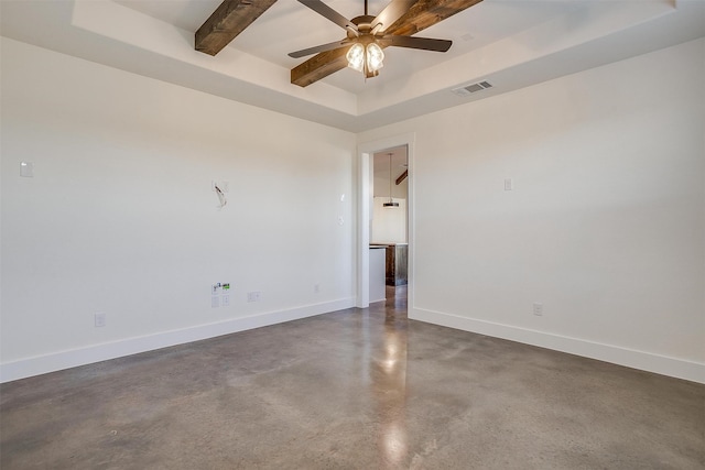 unfurnished room featuring beam ceiling, a tray ceiling, and ceiling fan