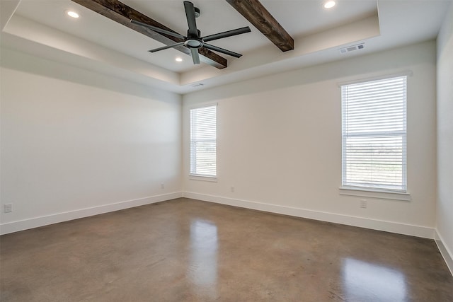 unfurnished room with ceiling fan, concrete floors, and beam ceiling