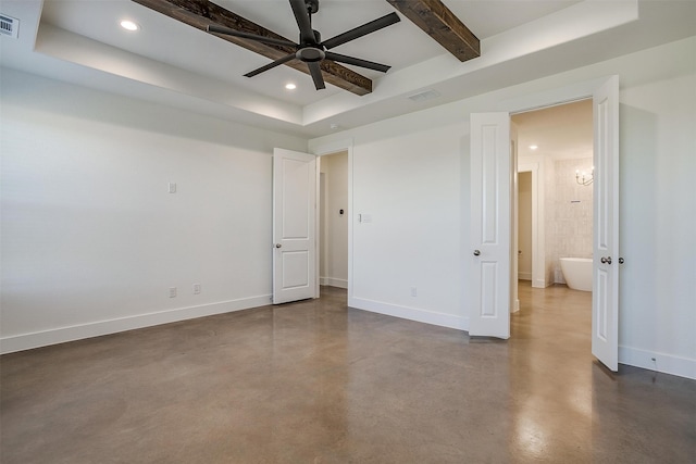 unfurnished bedroom featuring beam ceiling, a raised ceiling, ensuite bathroom, and ceiling fan