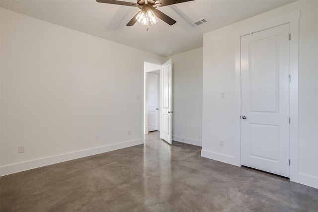 unfurnished bedroom with ceiling fan and concrete flooring