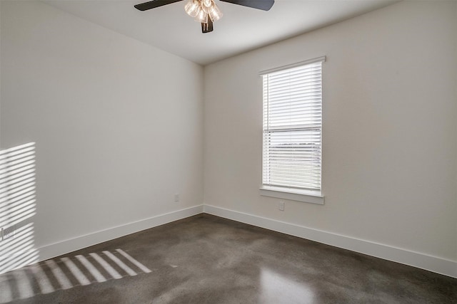 spare room with a healthy amount of sunlight and ceiling fan