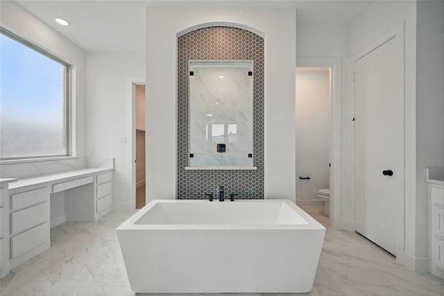 4029 Trellis Dr, Celina, TX 75078 - full bath with marble finish flooring, a shower stall, toilet, a freestanding bath, and recessed lighting