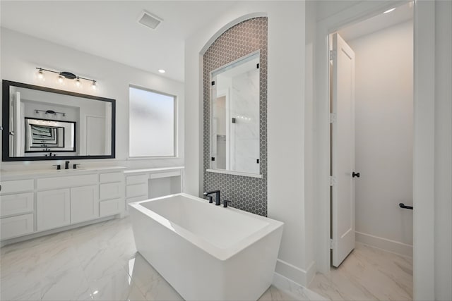 4029 Trellis Dr, Celina, TX 75078 - bathroom featuring marble tiled flooring, a soaking tub, baseboards, and vanity