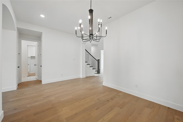4029 Trellis Dr, Celina, TX 75078 - unfurnished room featuring a chandelier, stairs, light wood-style flooring, baseboards, and recessed lighting