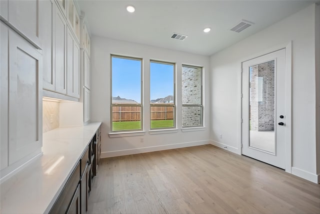 4029 Trellis Dr, Celina, TX 75078 - unfurnished dining area featuring plenty of natural light, light wood finished floors, baseboards, and recessed lighting