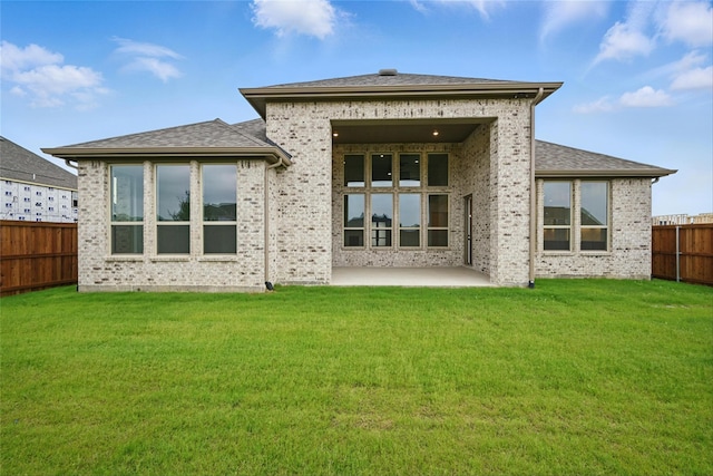 4029 Trellis Dr, Celina, TX 75078 - back of property with brick siding and a patio