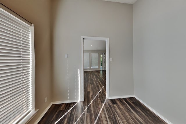 empty room featuring dark hardwood / wood-style flooring