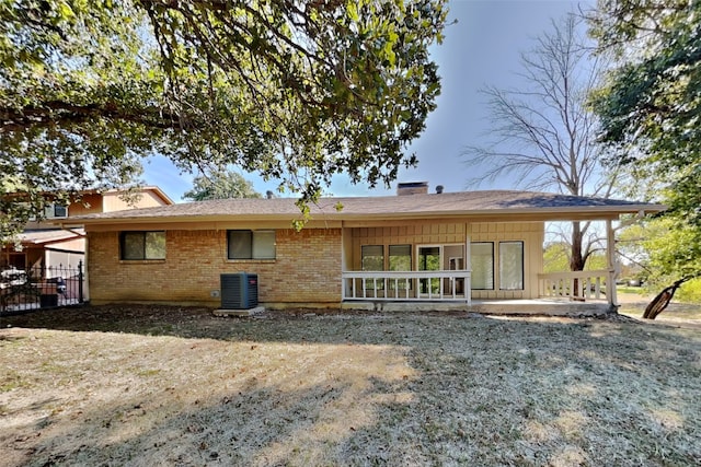 rear view of house with cooling unit