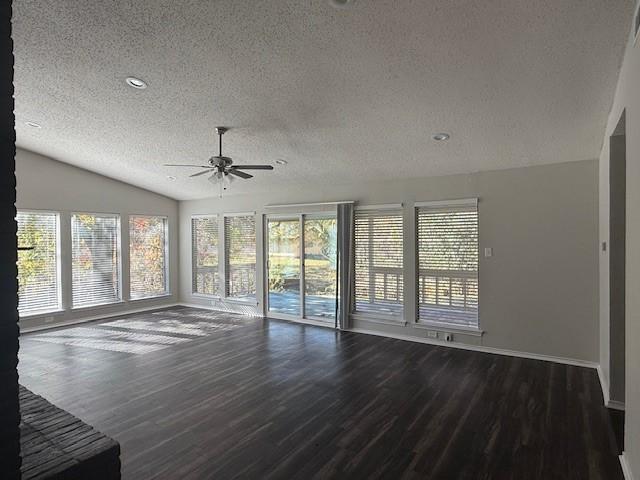 interior space featuring wood-type flooring, a textured ceiling, vaulted ceiling, and ceiling fan