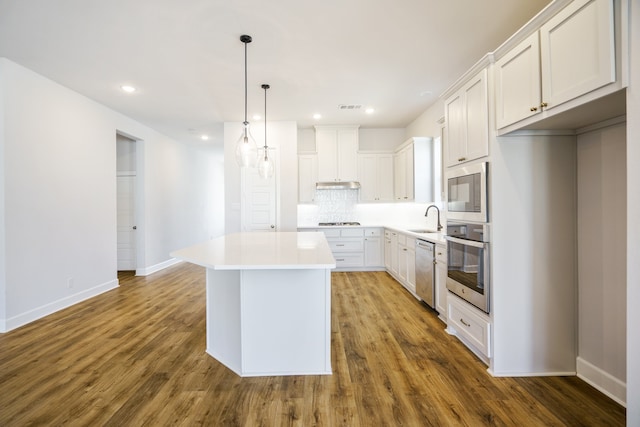 living room featuring ceiling fan and wood-type flooring