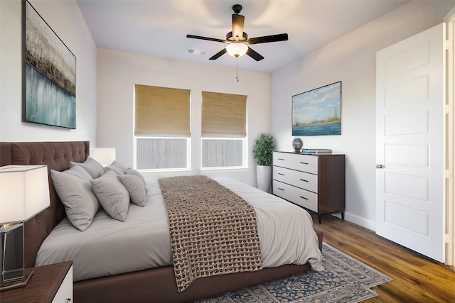 bedroom with dark wood-type flooring and ceiling fan