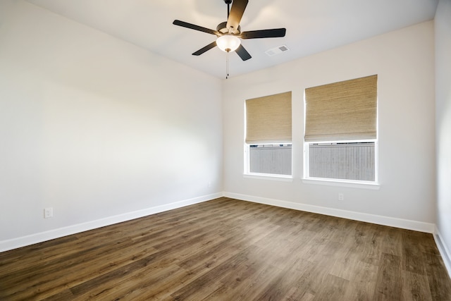 empty room featuring hardwood / wood-style floors and ceiling fan