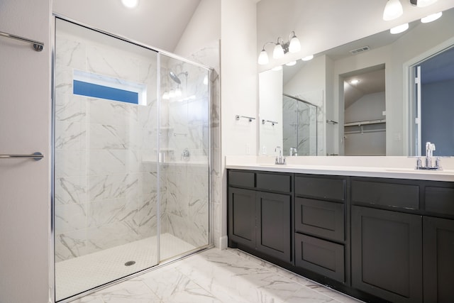 bathroom featuring vanity, an enclosed shower, and lofted ceiling