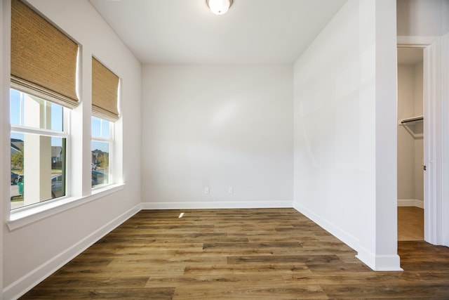 empty room featuring dark hardwood / wood-style flooring