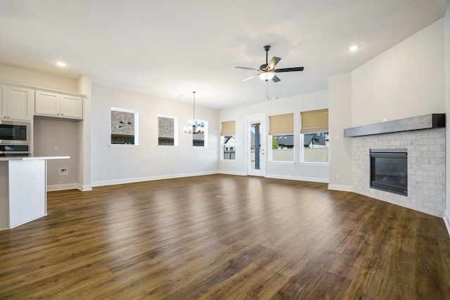 kitchen with stainless steel appliances, dark hardwood / wood-style floors, white cabinets, and a kitchen island