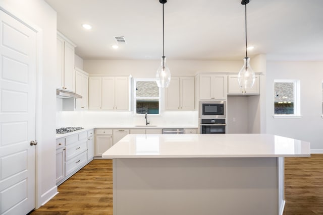 unfurnished dining area with dark wood-type flooring and a chandelier