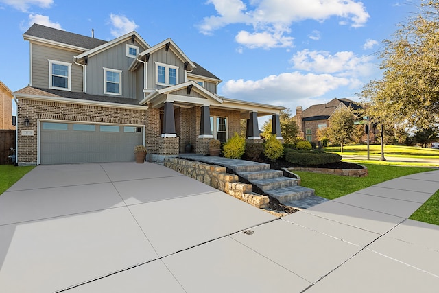 craftsman house featuring a front yard and a garage