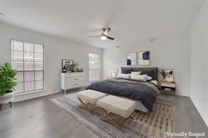 bedroom with ceiling fan and hardwood / wood-style flooring