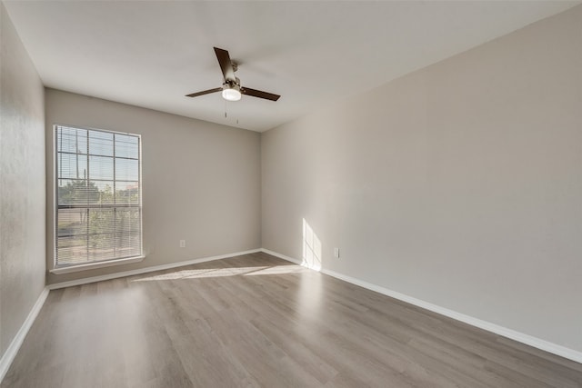 empty room featuring ceiling fan and light hardwood / wood-style floors