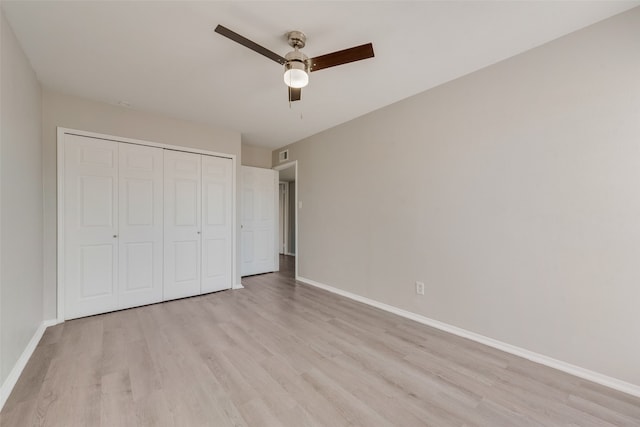 unfurnished bedroom featuring a closet, ceiling fan, and light hardwood / wood-style floors