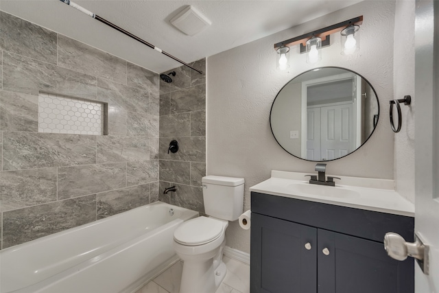 full bathroom with a textured ceiling, toilet, vanity, and tiled shower / bath