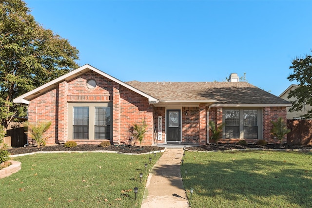 ranch-style house with a front yard