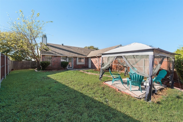 view of yard with a gazebo and a patio area