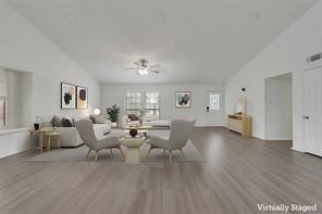 unfurnished living room with ceiling fan and hardwood / wood-style flooring