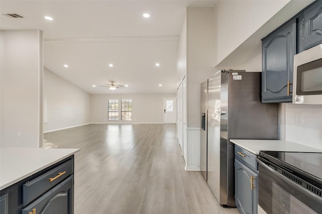 kitchen with light wood-type flooring and ceiling fan