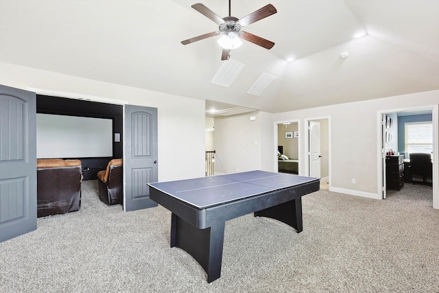 recreation room with light carpet, ceiling fan, and vaulted ceiling