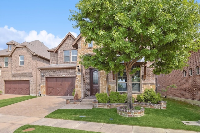 view of front facade with a garage and a front yard