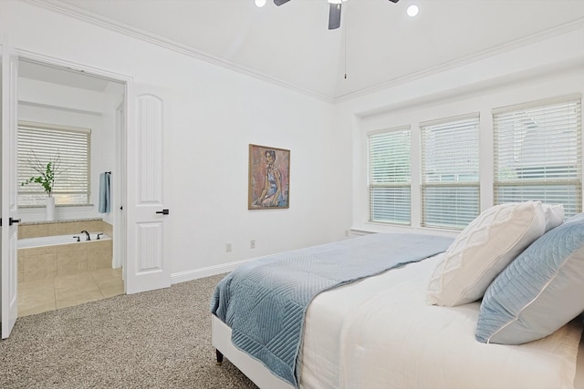 carpeted bedroom with ornamental molding and ceiling fan