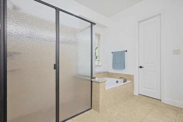 bathroom with tile patterned floors and separate shower and tub