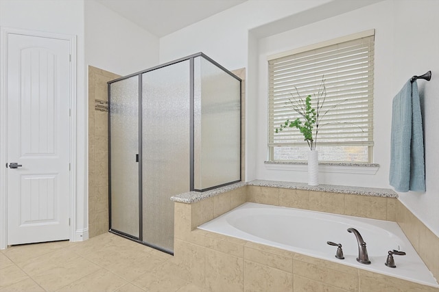 bathroom featuring tile patterned floors and plus walk in shower