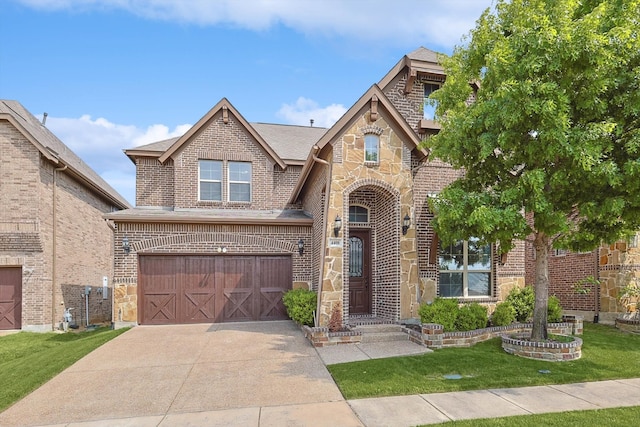 view of front of property featuring a garage and a front yard