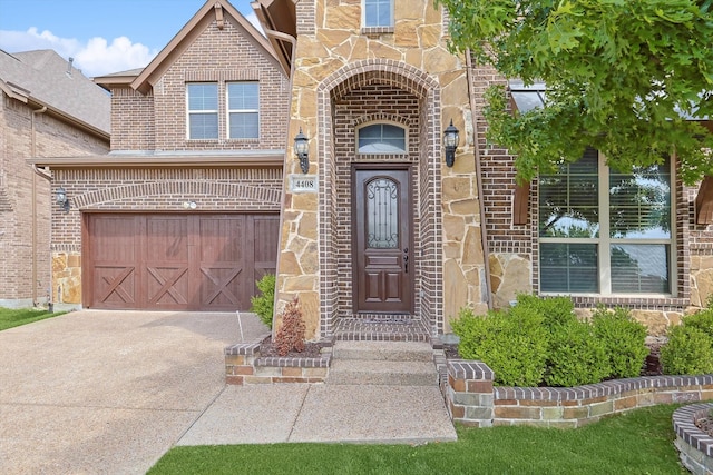 view of exterior entry with a garage