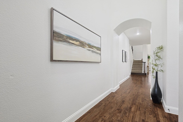 corridor with dark hardwood / wood-style floors