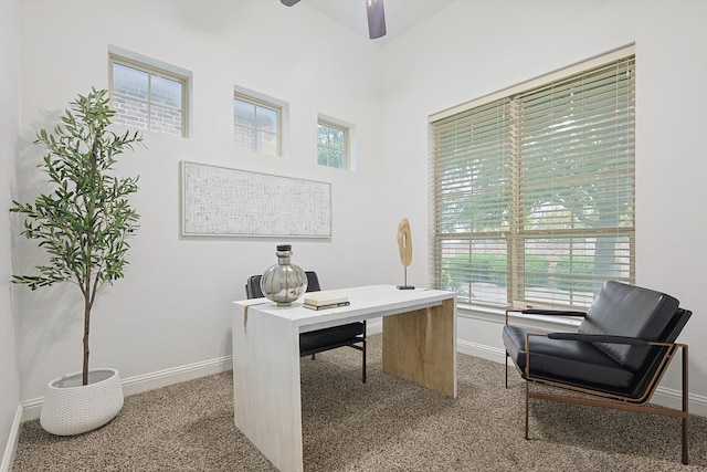 home office featuring ceiling fan, plenty of natural light, and carpet flooring