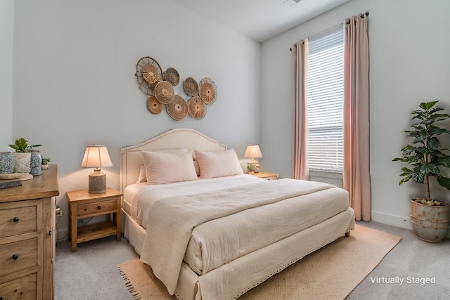 bedroom with light colored carpet