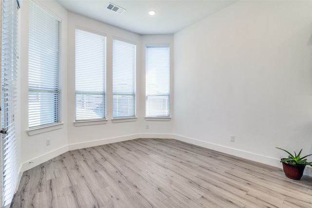 unfurnished room featuring light hardwood / wood-style floors