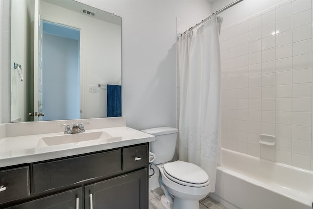 full bathroom featuring toilet, vanity, shower / bath combo with shower curtain, and tile patterned floors