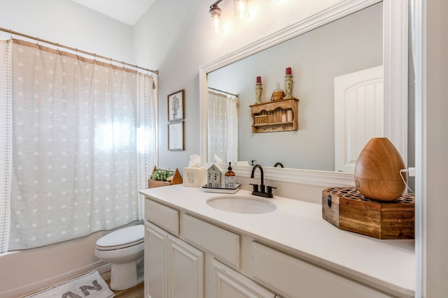 full bathroom with hardwood / wood-style floors, vanity, toilet, and shower / tub combo with curtain