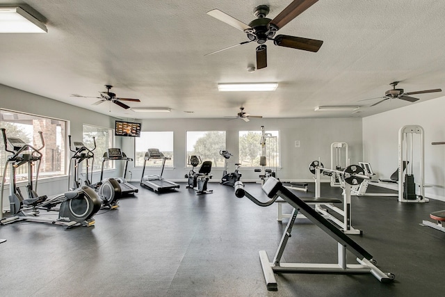 exercise room with a textured ceiling