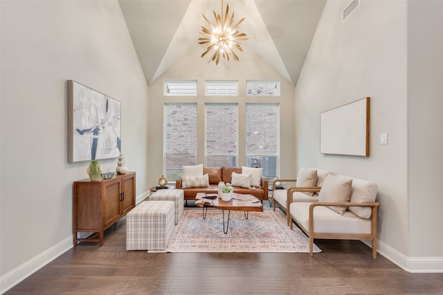 living room with lofted ceiling, a notable chandelier, and dark hardwood / wood-style floors