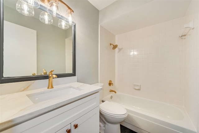 full bathroom with toilet, vanity, and tiled shower / bath