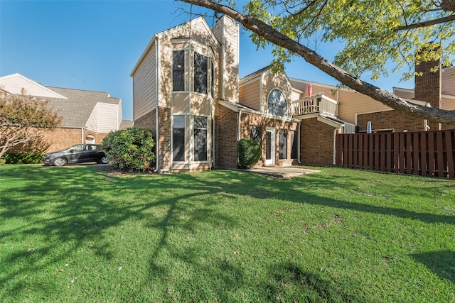 209 Cimarron Trl Unit 6, Irving, TX 75063 - rear view of property featuring a balcony, brick siding, and french doors