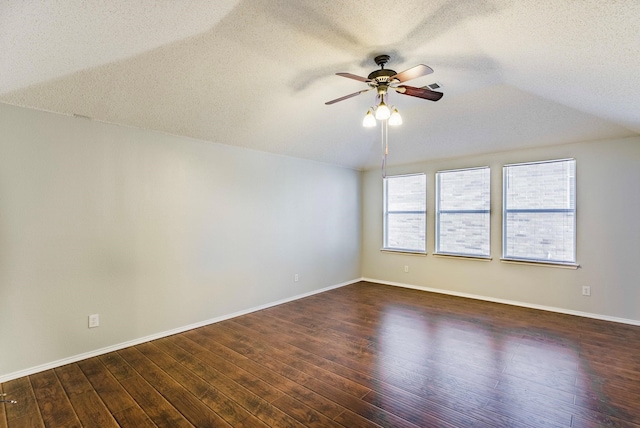 unfurnished room featuring ceiling fan, a textured ceiling, and dark hardwood / wood-style floors