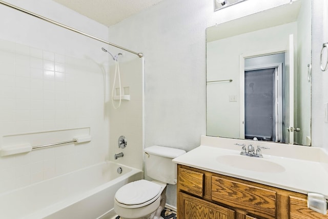 full bathroom with toilet, vanity, a textured ceiling, and shower / washtub combination